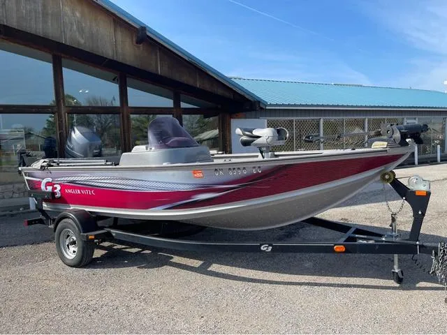 Slide: The Image of 2015 G3 V172C boat on trailer, parked outside a building with blue roof. - 1