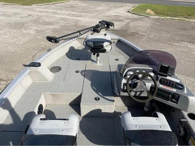 Slide: The Image of 2015 G3 V172C boat interior with steering wheel, seats, and control panel. - 12