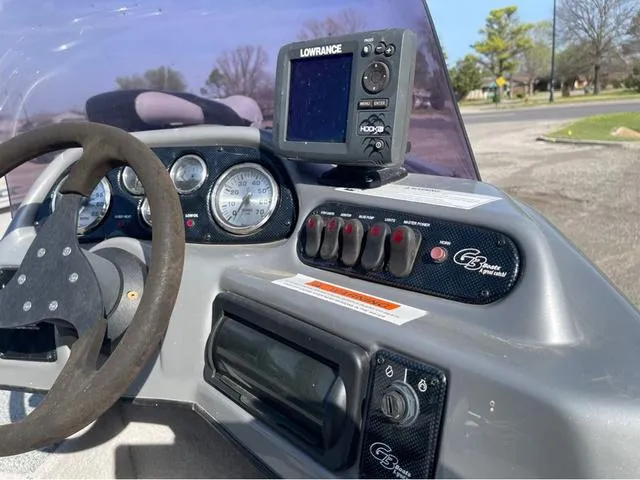 Slide: The Image of Boat dashboard with Lowrance GPS, steering wheel, and control panel, G3 V172C, 2015 model. - 14