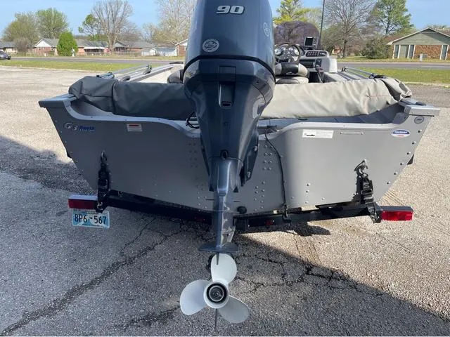 Slide: The Image of 2015 G3 V172C boat with 90 HP outboard motor, parked on a trailer. - 5