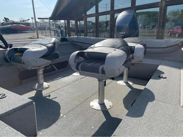 Slide: The Image of 2015 G3 V172C boat interior with swivel seats and 90 HP outboard motor. - 9