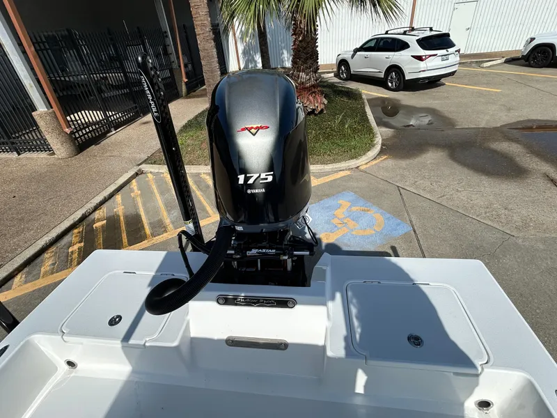 Slide: The Image of 2025 Shallow Sport 22 Sport boat with Yamaha 175 engine in parking lot. - 7