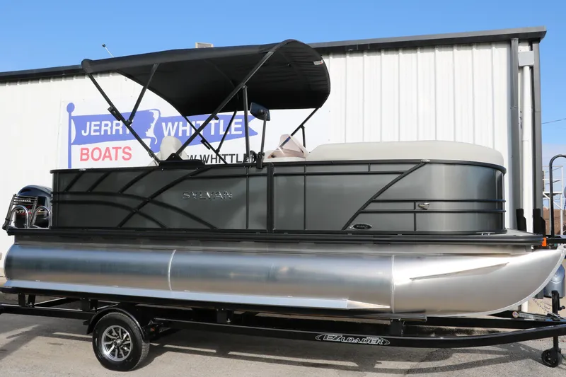 The Image of 2025 Sylvan Mirage 820 Party Fish Premium Pontoon with canopy on trailer, outside dealership. - 1