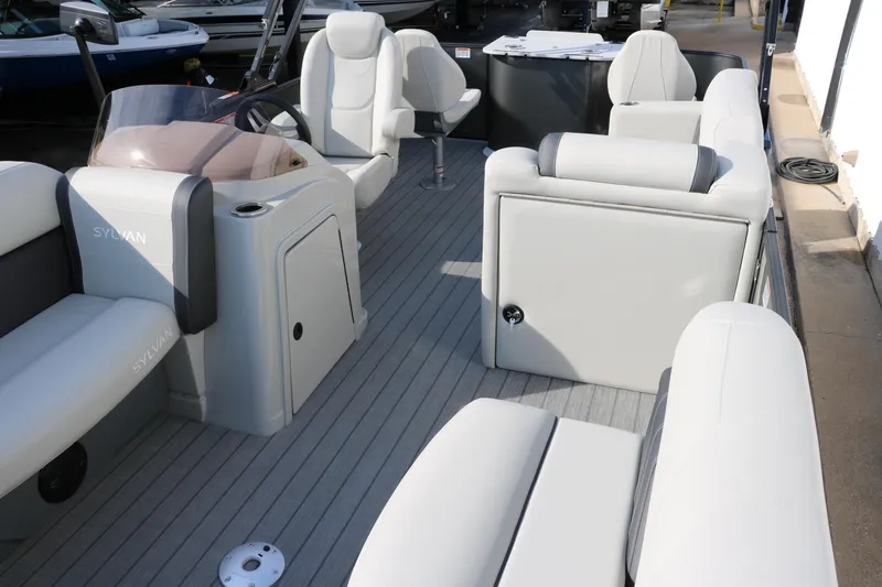 Slide: The Image of 2025 Sylvan Mirage 820 Party Fish Premium Pontoon interior with plush seating and modern design. - 17