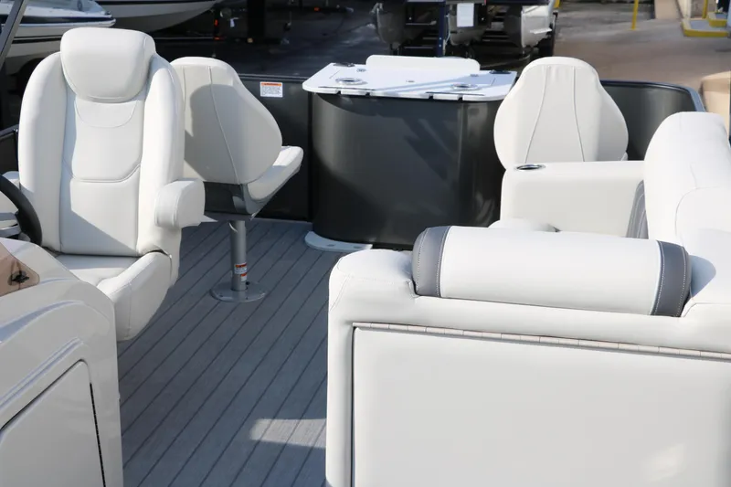 Slide: The Image of 2025 Sylvan Mirage 820 Party Fish Premium Pontoon interior with plush seating and modern design. - 19