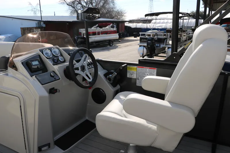Slide: The Image of 2025 Sylvan Mirage 820 Party Fish Premium Pontoon helm with white captain's chair. - 22