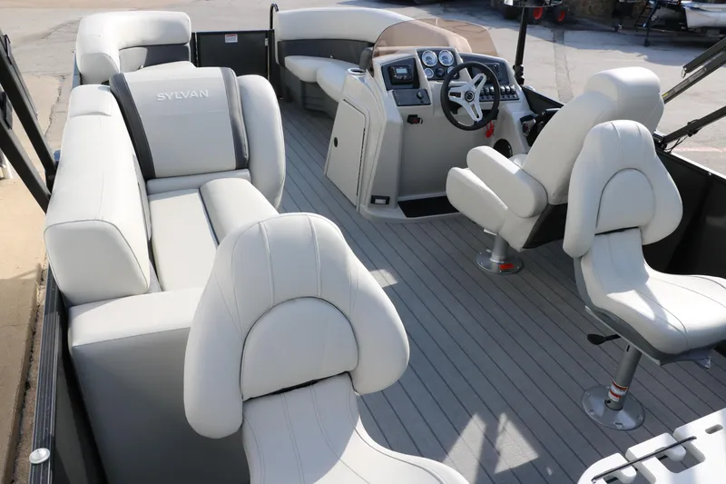 Slide: The Image of 2025 Sylvan Mirage 820 Party Fish Premium Pontoon interior with luxurious seating and modern dashboard. - 26