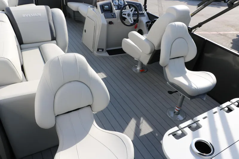 Slide: The Image of 2025 Sylvan Mirage 820 Party Fish Premium Pontoon interior with plush seating and modern dashboard. - 27