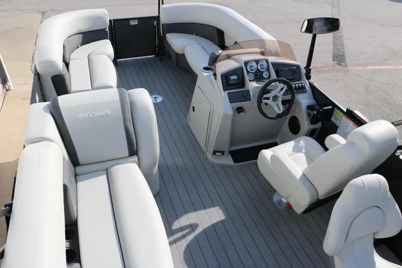 Slide: The Image of 2025 Sylvan Mirage 820 Party Fish Premium Pontoon interior with plush seating and modern dashboard. - 29