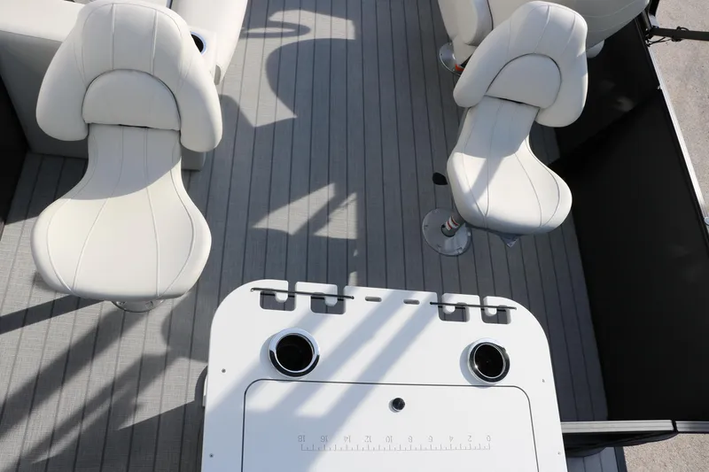 Slide: The Image of 2025 Sylvan Mirage 820 Party Fish Premium Pontoon interior with white seating and table. - 31