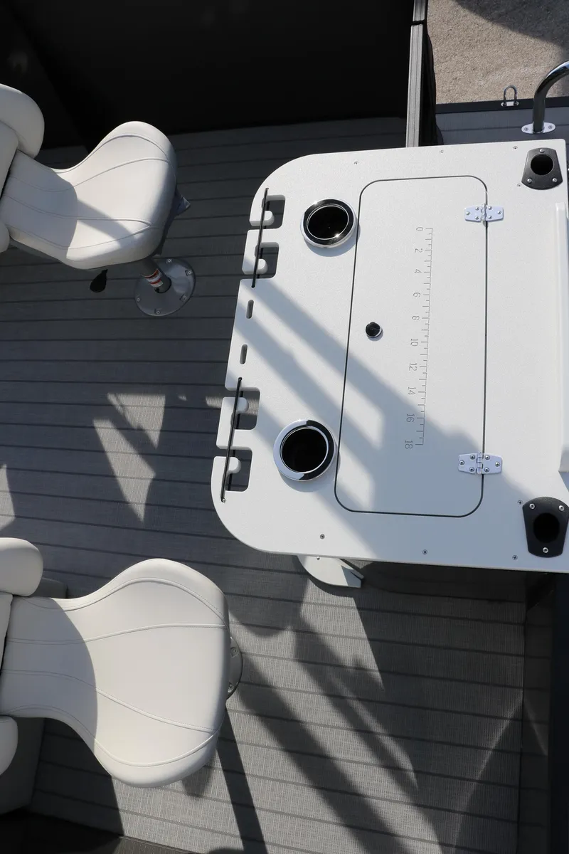 Slide: The Image of 2025 Sylvan Mirage 820 Party Fish Premium Pontoon interior with seating and table. - 32