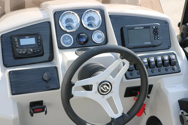 Slide: The Image of 2025 Sylvan Mirage 820 Party Fish Premium Pontoon dashboard with steering wheel and control panel. - 35