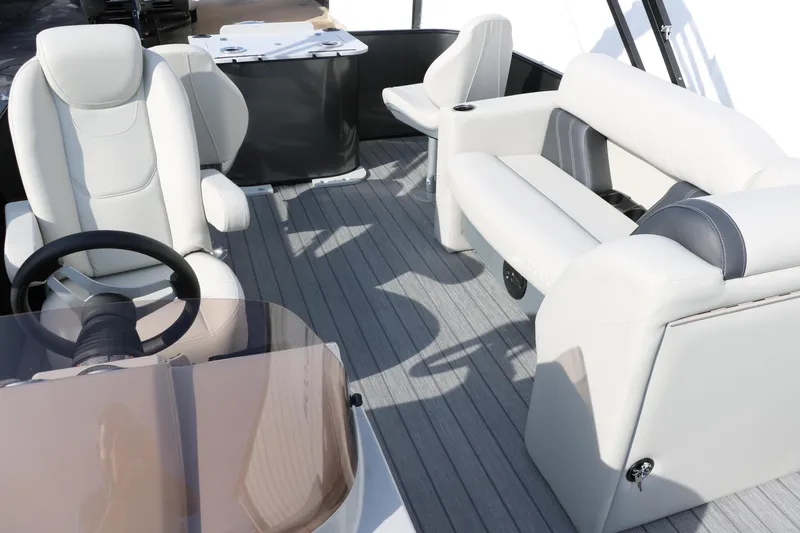 Slide: The Image of 2025 Sylvan Mirage 820 Party Fish Premium Pontoon interior with luxurious seating and steering console. - 41
