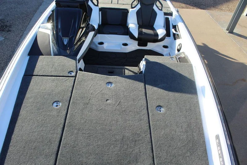 Slide: The Image of 2025 Skeeter FXR20L boat interior with cushioned seating and spacious deck layout. - 10