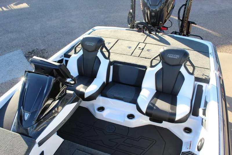 Slide: The Image of 2025 Skeeter FXR20L boat interior with dual seats and console, showcasing modern design. - 14