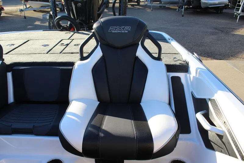 Slide: The Image of 2025 Skeeter FXR20L boat seat, black and white design, outdoor setting. - 15