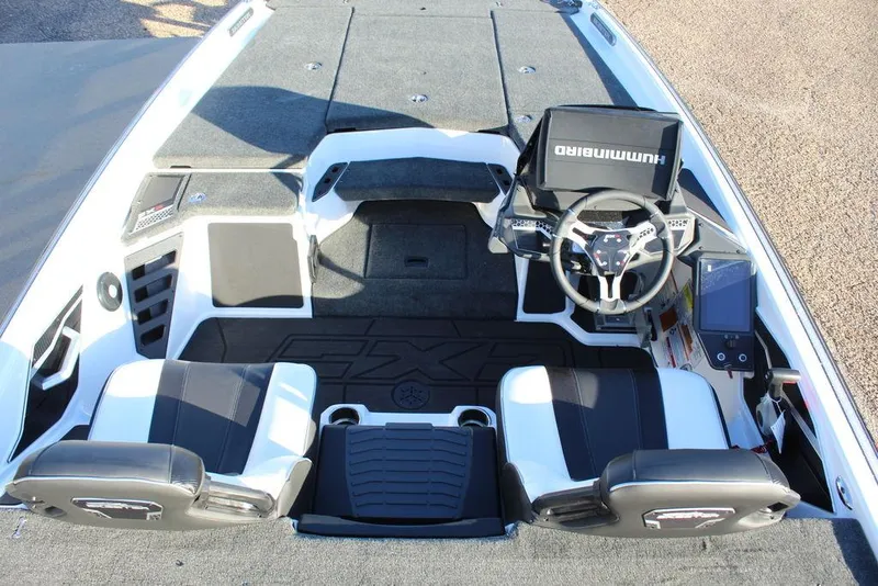 Slide: The Image of 2025 Skeeter FXR20L boat interior with dual seats and advanced navigation system. - 19