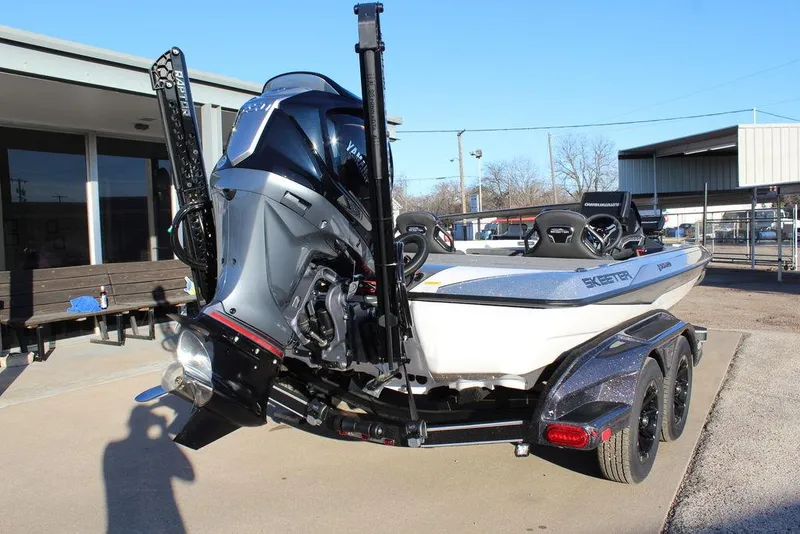Slide: The Image of 2025 Skeeter FXR20L boat on trailer, rear view, outdoor setting. - 5