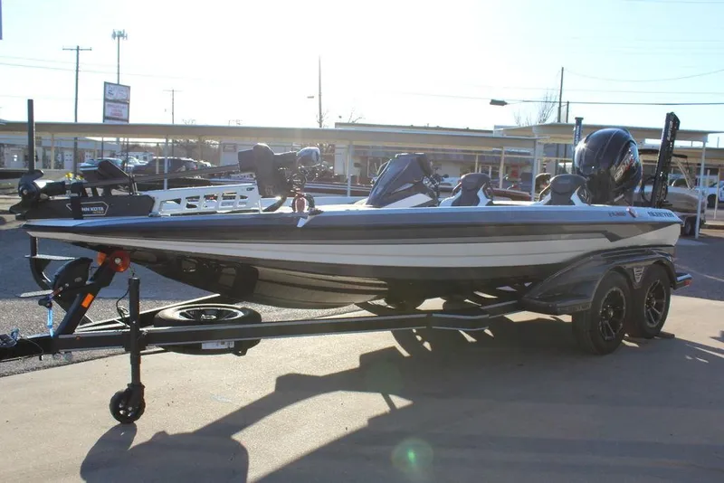 Slide: The Image of 2025 Skeeter FXR20L boat on trailer in outdoor setting. - 7