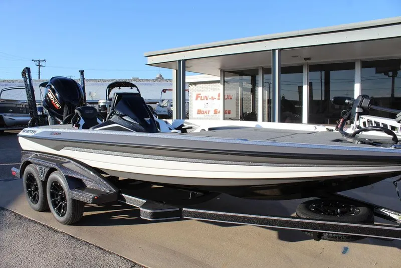 Slide: The Image of 2025 Skeeter FXR20L boat displayed outside dealership. - 9