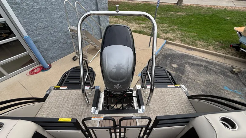 Slide: The Image of 2025 JC Neptoon 25TT Sport boat, rear view with motor and deck details. - 10