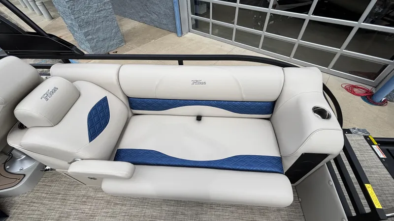 Slide: The Image of 2025 JC Neptoon 25TT Sport boat interior with white and blue seating. - 12