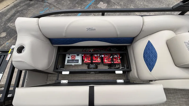 Slide: The Image of 2025 JC Neptoon 25TT Sport boat seat with battery storage compartment open. - 15
