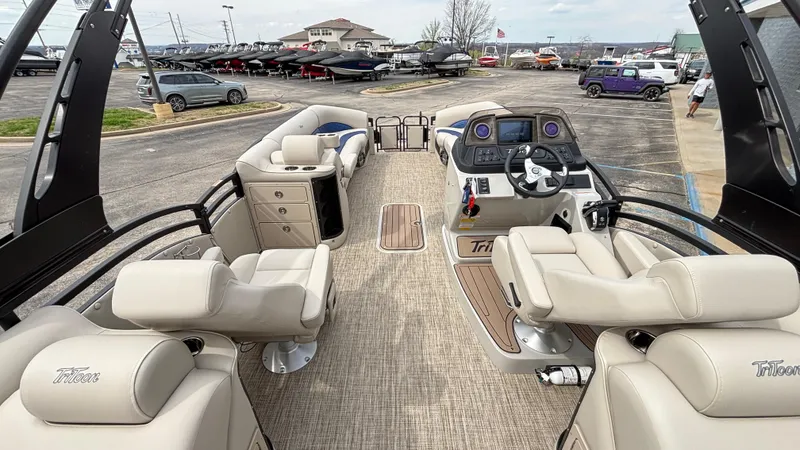 Slide: The Image of 2025 JC Neptoon 25TT Sport pontoon boat with luxurious seating and modern dashboard. - 17
