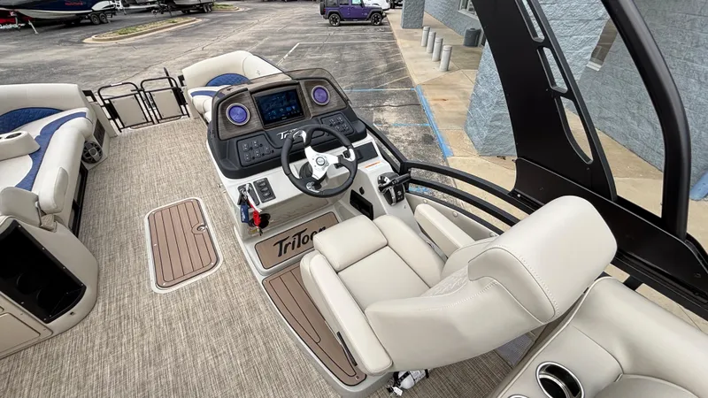 Slide: The Image of 2025 JC Neptoon 25TT Sport boat interior with modern helm and comfortable seating. - 20