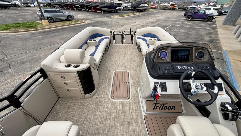 Slide: The Image of 2025 JC Neptoon 25TT Sport pontoon boat interior with luxurious seating and modern dashboard. - 22