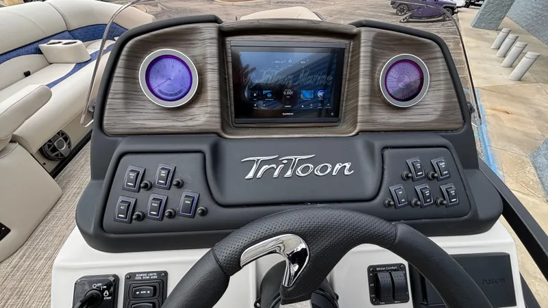 Slide: The Image of 2025 JC Neptoon 25TT Sport dashboard with steering wheel and control panel. - 24