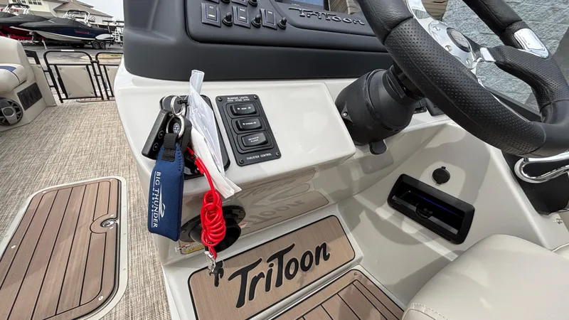Slide: The Image of 2025 JC Neptoon 25TT Sport dashboard with steering wheel and control panel. - 25