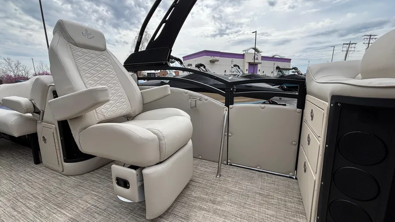 Slide: The Image of Luxurious interior of 2025 JC Neptoon 25TT Sport pontoon boat with plush seating. - 30