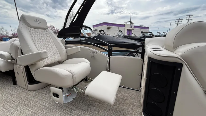 Slide: The Image of Luxurious interior of 2025 JC Neptoon 25TT Sport pontoon boat with plush seating. - 31