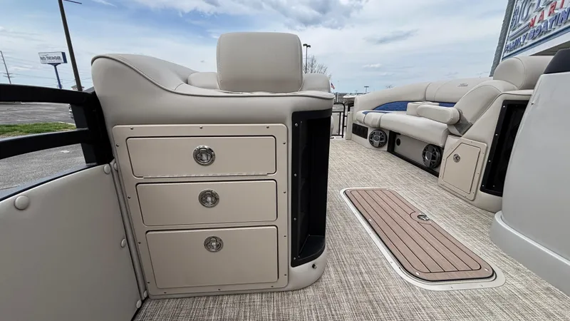 Slide: The Image of Interior of 2025 JC Neptoon 25TT Sport boat with seating and storage drawers. - 32