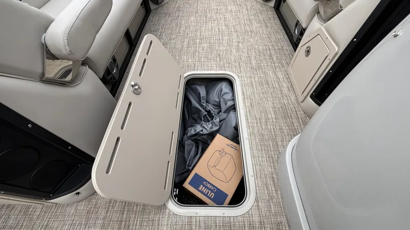 Slide: The Image of 2025 JC Neptoon 25TT Sport boat interior storage compartment with box and fabric. - 35