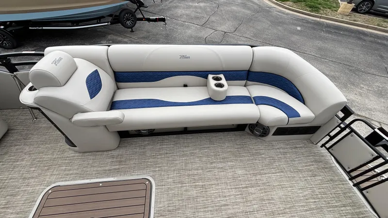 Slide: The Image of 2025 JC Neptoon 25TT Sport boat interior with plush seating and cup holders. - 37