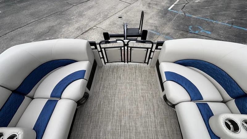 Slide: The Image of 2025 JC Neptoon 25TT Sport pontoon boat interior with plush seating and modern design. - 38