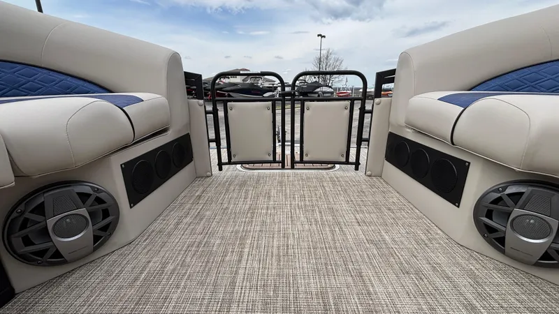 Slide: The Image of 2025 JC Neptoon 25TT Sport boat interior with plush seating and built-in speakers. - 39