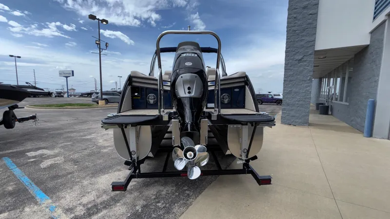 Slide: The Image of 2025 JC Neptoon 25TT Sport pontoon boat, rear view, parked on trailer. - 6