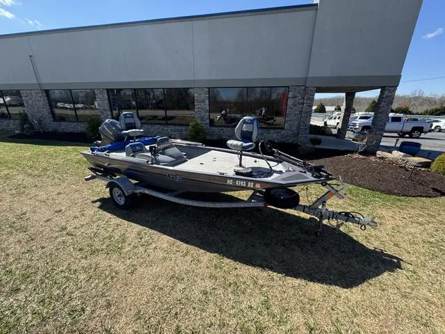 Slide: The Image of 2007 G3 Eagle 165 boat on trailer outside a building, sunny day. - 1