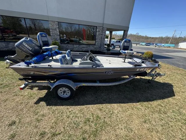 Slide: The Image of 2007 G3 Eagle 165 boat with Yamaha motor on trailer, parked outdoors. - 2