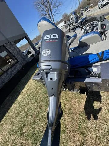 Slide: The Image of 2007 G3 Eagle 165 boat with 60 HP four-stroke engine, parked outdoors. - 3