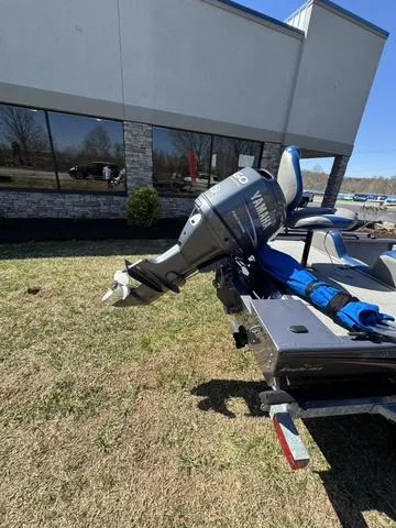 Slide: The Image of 2007 G3 Eagle 165 boat with Yamaha outboard motor on a trailer, parked outdoors. - 4