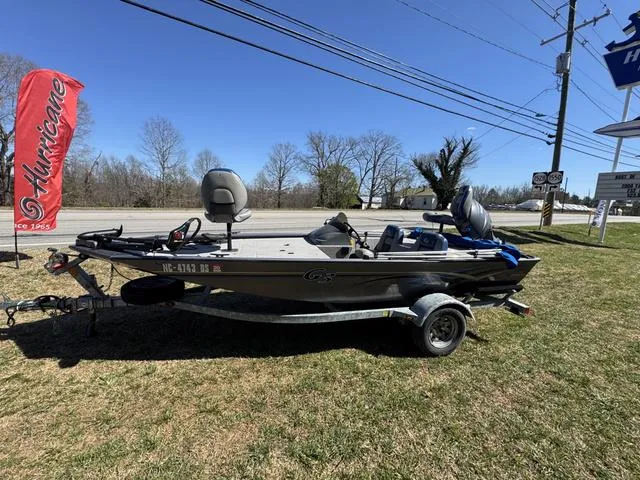 Slide: The Image of 2007 G3 Eagle 165 boat on trailer, parked on grass near road with red flag. - 9
