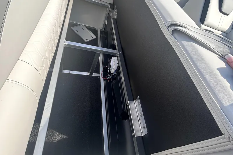 Slide: The Image of Interior storage compartment of 2025 Avalon 2385 LSZ boat, showcasing seating and frame structure. - 10