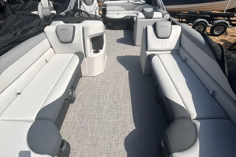 Slide: The Image of 2025 Avalon 2385 LSZ boat interior with gray seating and carpet flooring. - 5