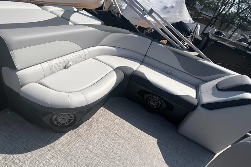 Slide: The Image of 2025 Avalon 2385 LSZ boat interior with sleek gray seating and integrated speakers. - 6