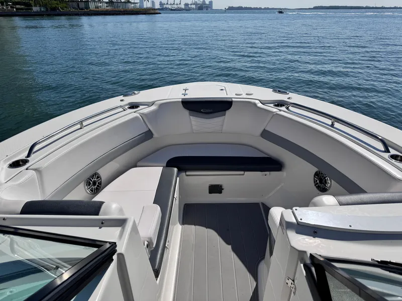 Slide: The Image of 2021 Robalo R317 Dual Console boat with spacious seating on calm water. - 22