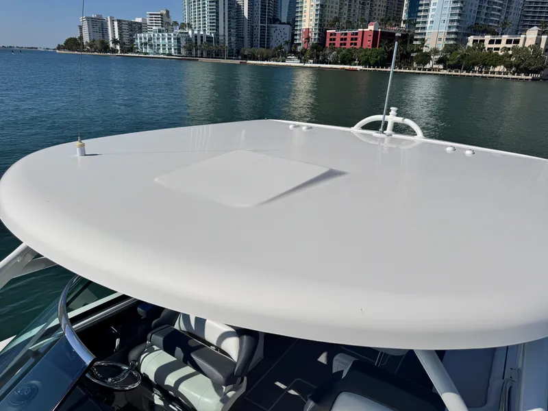 Slide: The Image of 2021 Robalo R317 Dual Console boat with city skyline in background. - 23